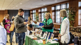 Participants at the 2022 IDEA Conference visit the community booths.