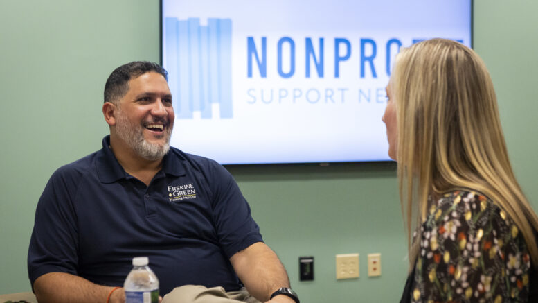 Daniel Gurule, Manager of Donor Relations for The Arc of Indiana Foundation and Erskine Green Training Institute interacts with Mandy Williams, Vice President of Programs at LifeStream Services, Inc., during a peer group meeting in 2022.