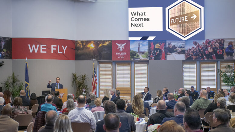 Muncie Mayor Dan Ridenour is pictured giving his 3rd annual State of the City report at the Ball State Alumni Center. His slide presentation appeared on numerous television monitors circling the meeting room. Photo by Mike Rhodes