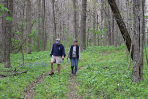 A couple is pictured enjoying the trail at Red-tail’s 2022 Wildflower Celebration. Photo by Elizabeth Ploog