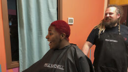 Event Coordinator SteVen Knipp looks on as a client admires her new hairstyle at SteVen Knipp Hair Studio, located at Madjax. Photo by Emily Helms.