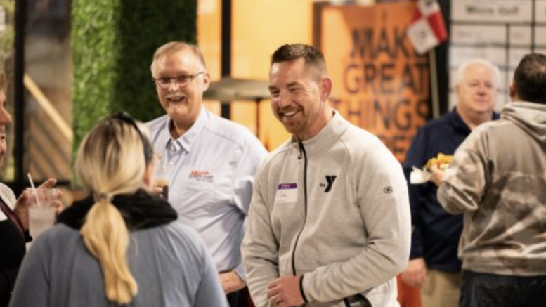 Nonprofit workers enjoyed celebrating the end of the year at the Nonprofit Holiday Celebration in December 2022 at The Clubhouse at Accutech. Pictured is Chad Zaucha, President/CEO of YMCA of Muncie, and Jeff Bryan, Director of Visitor Experience of Muncie Delaware County Visitors Bureau.