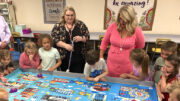 Dr. Jenner (pictured on right) visits Daleville Elementary School where kindergartners are learning coding skills. Photo provided