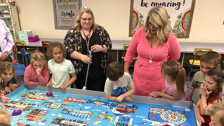 Dr. Jenner (pictured on right) visits Daleville Elementary School where kindergartners are learning coding skills. Photo provided