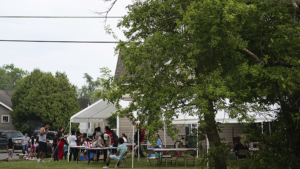 Families and youth enjoying a cookout in the Industry Neighborhood hosted by Urban Light Community Development. Photo provided