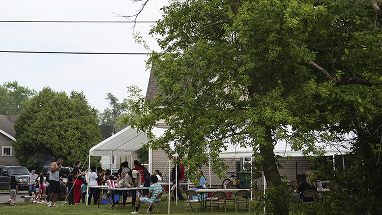 Families and youth enjoying a cookout in the Industry Neighborhood hosted by Urban Light Community Development. Photo provided