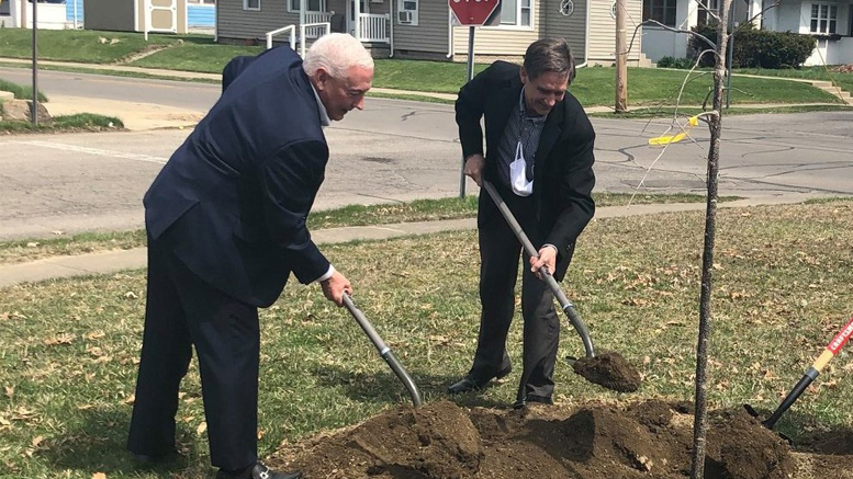 Congressman Greg Pence plants a tree with Muncie Mayor Dan Ridenour. Photo provided