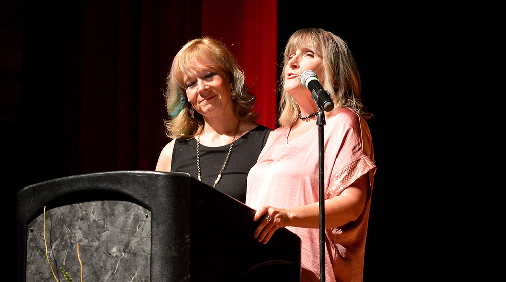 L-R: Emcees Laura Williamson and Michelle Kinsey.