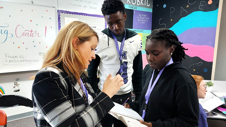 Writing Center Director Morgan Leckie instructs students on a writing project. Photo provided