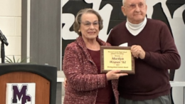 Forrest Bowers, a 1957 graduate of Muncie Central and chairman of the Muncie Central Alumni Association’s Distinguished Alumni Committee, presents Marilyn Weaver, 1961, with her Distinguished Alumni Award plaque.