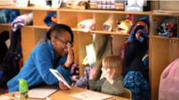 Grissom Elementary School educator and student work together on the alphabet. Photo by Maggie Manor.