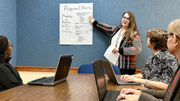 Laura Janiga, MPL employee, reviews the Grant Writing Learning Circle agenda with other MPL employees. Photo by Spenser Querry, MPL Webmaster and Social Media Specialist.