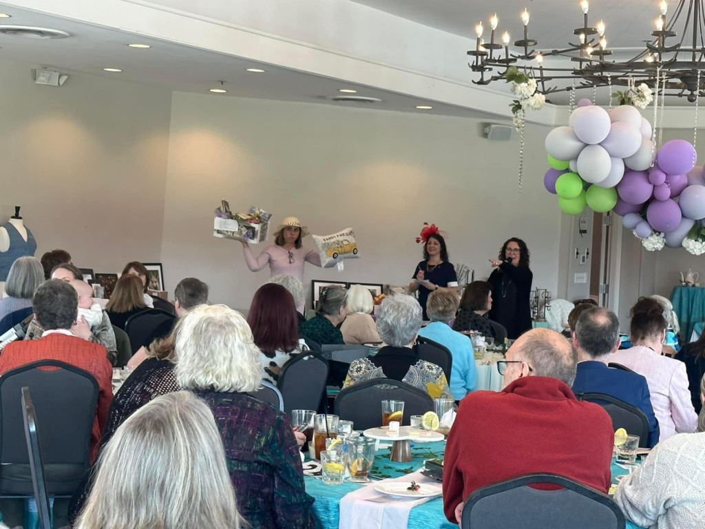 Altrusans (from left to right): Lorraine Tomlin, Susan Volbrecht and Leigh Edwards auctioning items at the 2023 event. Photo provided