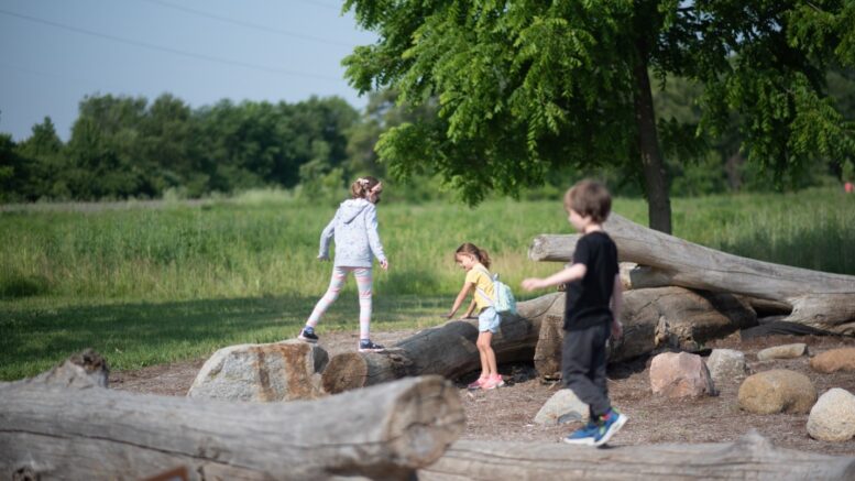 Children play at Red-tail Land Conservancy’s Dutro-Ernst Woods’ Nature Area. Photo by Maggie Manor