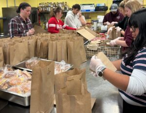 Volunteers are pictured preparing sack lunches at the Soup Kitchen of Muncie. Photo provided.