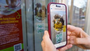 Participants will scan DWNTWN Wonder Hunt “Mousecapades” window decals to reveal an animated 3D mouse created in partnership with Ball State’s IDIA Lab. Fifty interactive mice are hidden throughout downtown storefronts for this year’s holiday Wonder Hunt adventure. Photo provided.