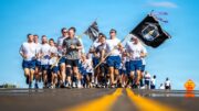 U.S. Service members run together during a base wide run at Buckley Space Force Base, Colorado, Oct. 9, 2025. The event showcased the importance of personal fitness and teamwork in maintaining a combat ready force. U.S. Space Force photo by Tech. Sgt. Jordan Thompson.