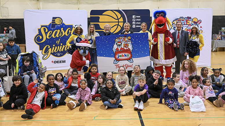Children gather with Pacers Sports & Entertainment staff, Indiana Pacers mascot Boomer, Indiana Fever mascot Freddy Fever, Indiana Pacemates, Muncie Mayor Dan Ridenour and Muncie Police Department Deputy Chief Melissa Criswell for the Big Toy Giveaway at Muncie Central High School on Tuesday, Dec. 9, 2025.