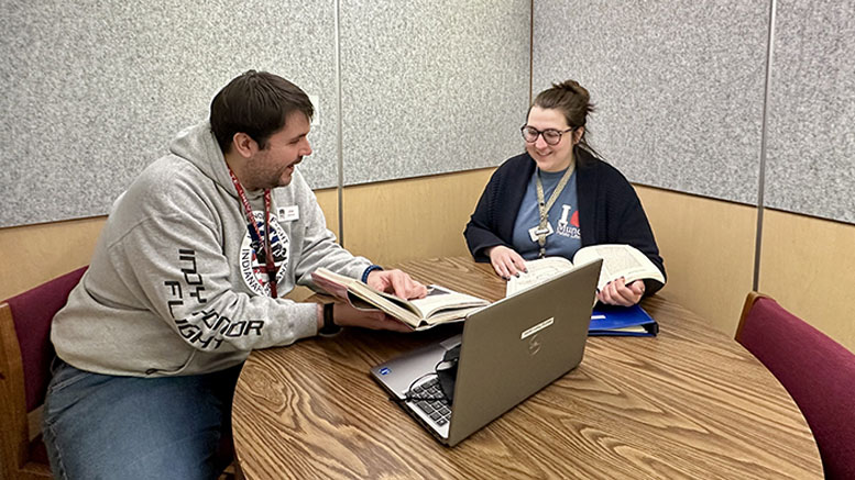 MPL employees Joe Nelson and Laura Janiga use the meeting space inside one of the new Zenbooth pods available for reservations at Kennedy Library. Photo by Spenser Querry, MPL Public Relations.