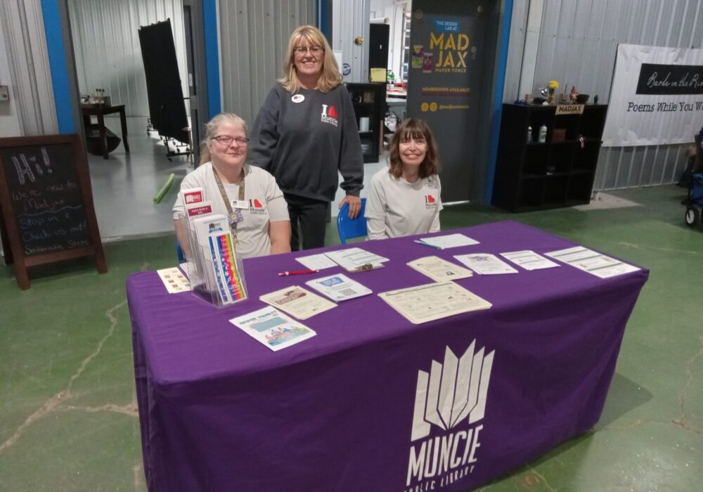 MPL staff Laura Geesy, Susan Fisher, and Donna Catron at the libray info table at the Big Read KickOff Party in 2025