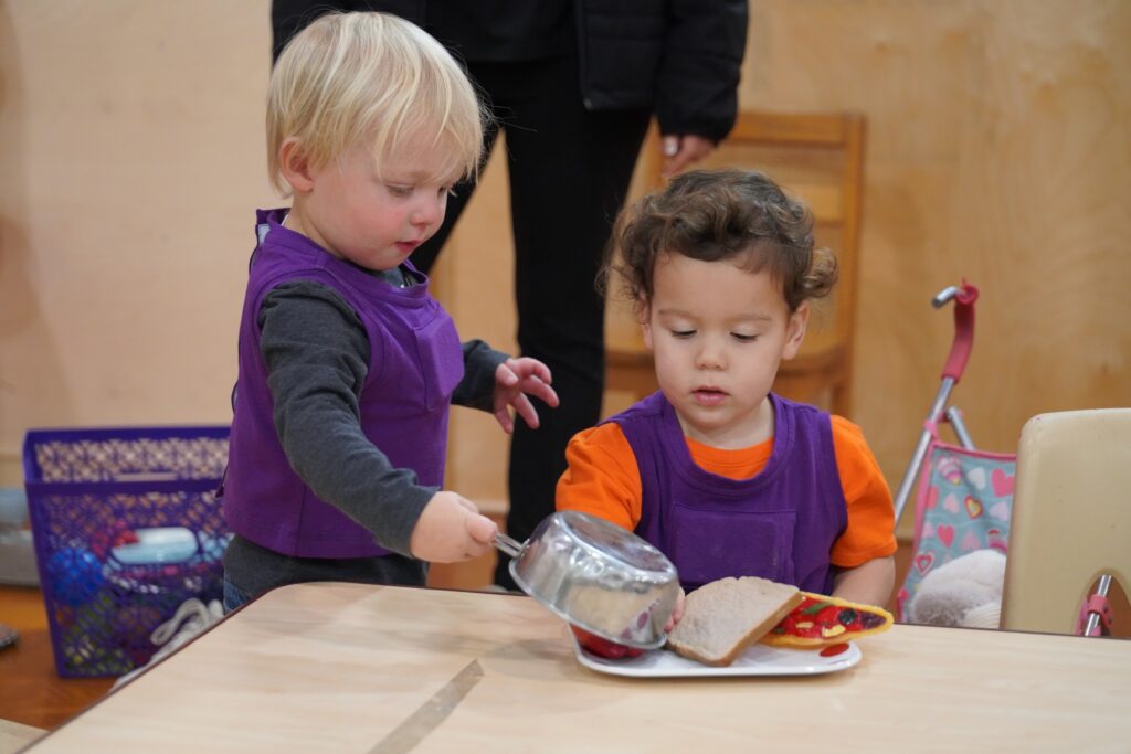 Children wear purple vests that track conversational data in the classroom for the LENA Grow Program. Photo provided.