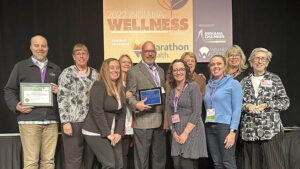 Community members from Delaware County were present to receive the Indiana Healthy Community redesignation certificate and to support John Disher, the Community Wellness Champion award recipient. Photo provided.